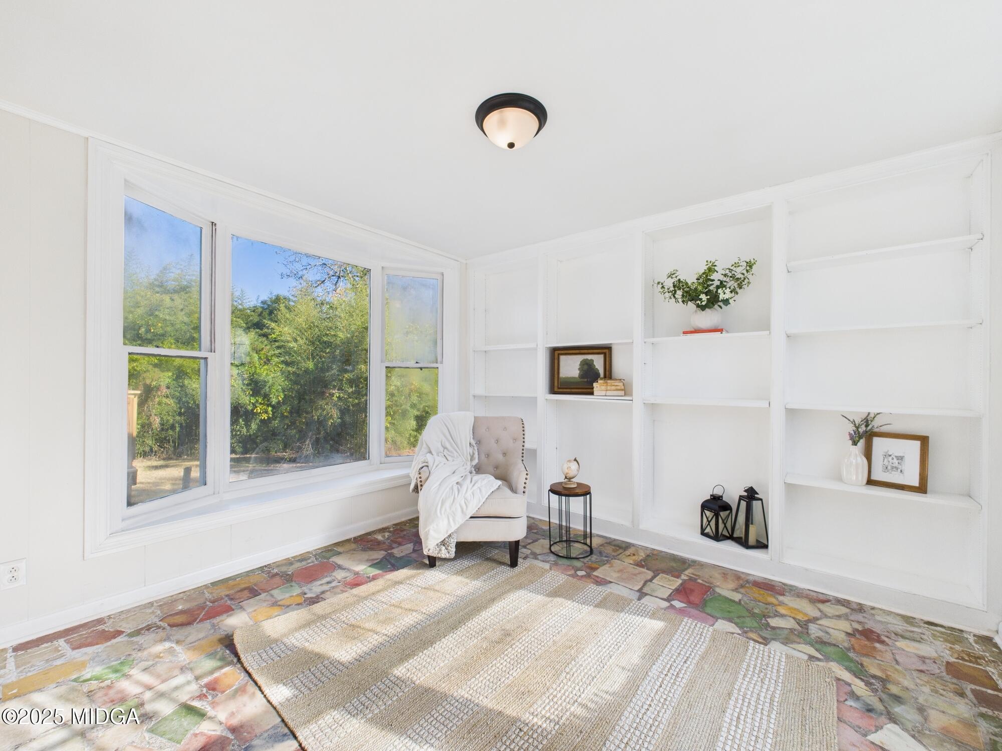 621 Forest Hill Road Macon, GA 31210 - Photo 19 of 50 a bed room with a bed and a window