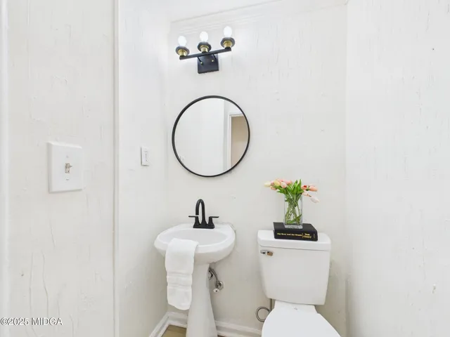 a view of a livingroom with a fireplace and a window