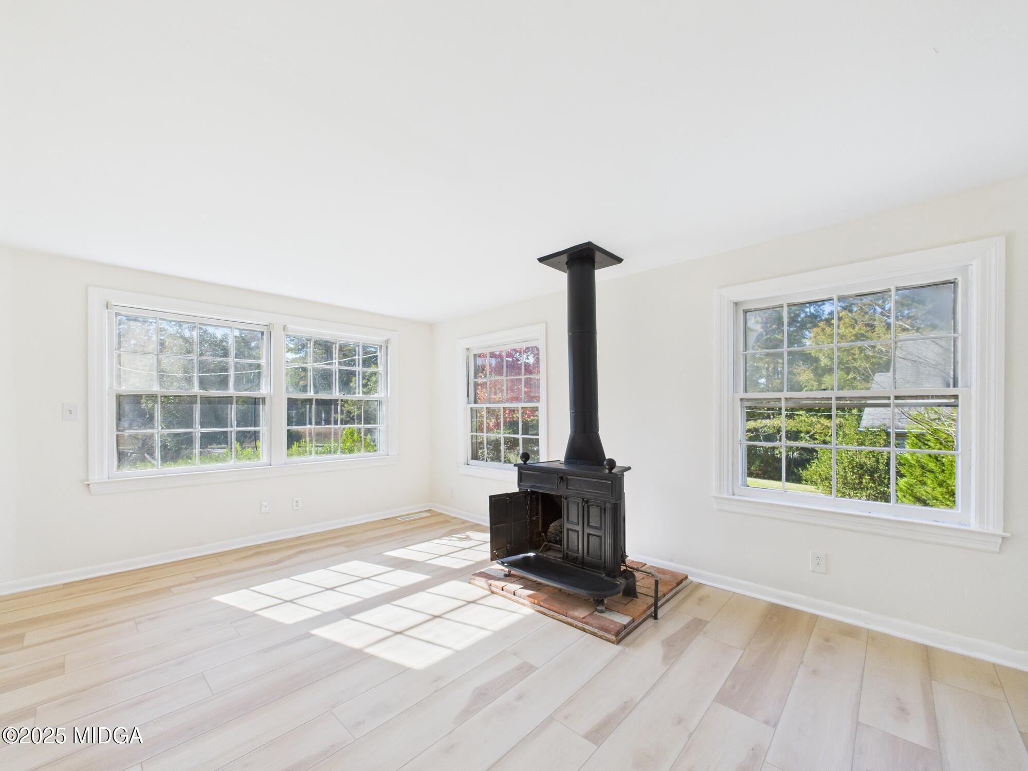 621 Forest Hill Road Macon, GA 31210 - Photo 24 of 50 a view of a livingroom with a fireplace and a window