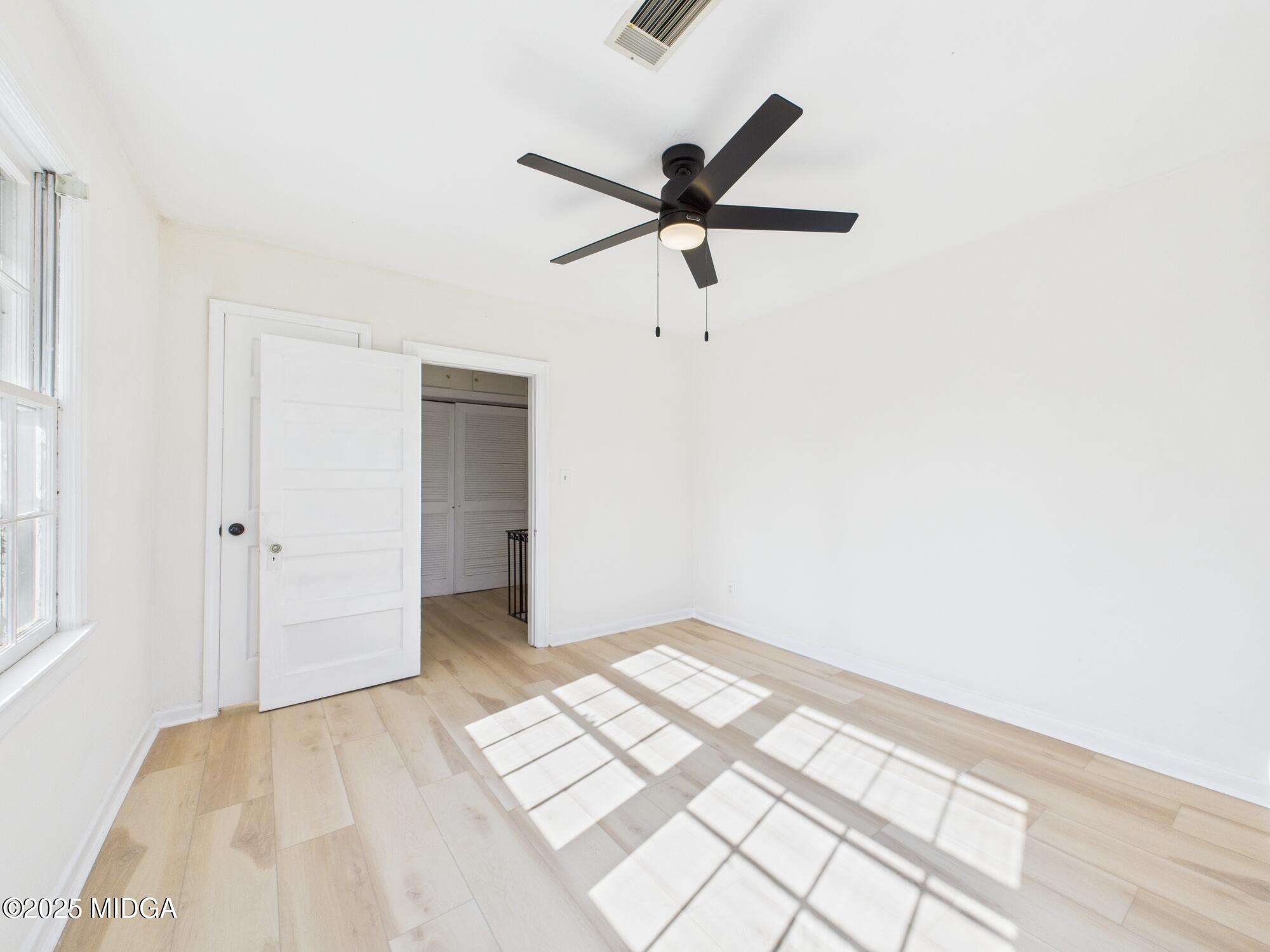 621 Forest Hill Road Macon, GA 31210 - Photo 32 of 50 a view of a big room with wooden floor and closet