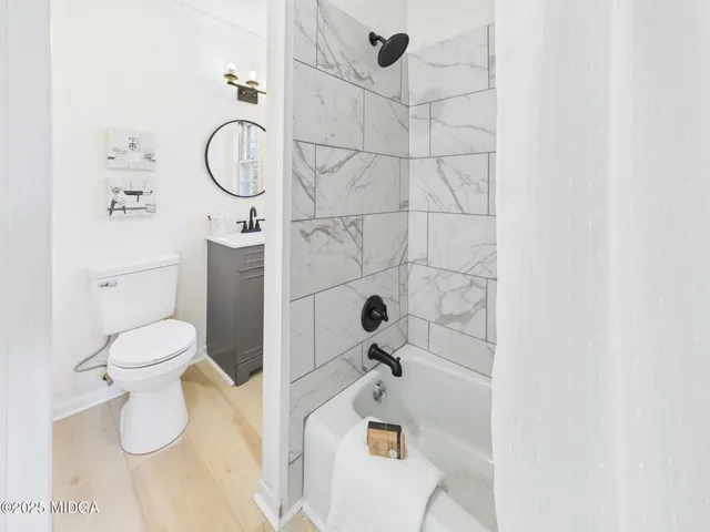 a bathroom with a sink a mirror and a toilet