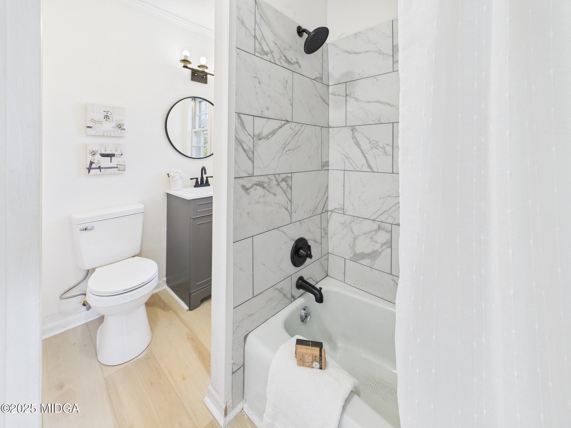 621 Forest Hill Road Macon, GA 31210 - Photo 34 of 50 a bathroom with a toilet and a shower