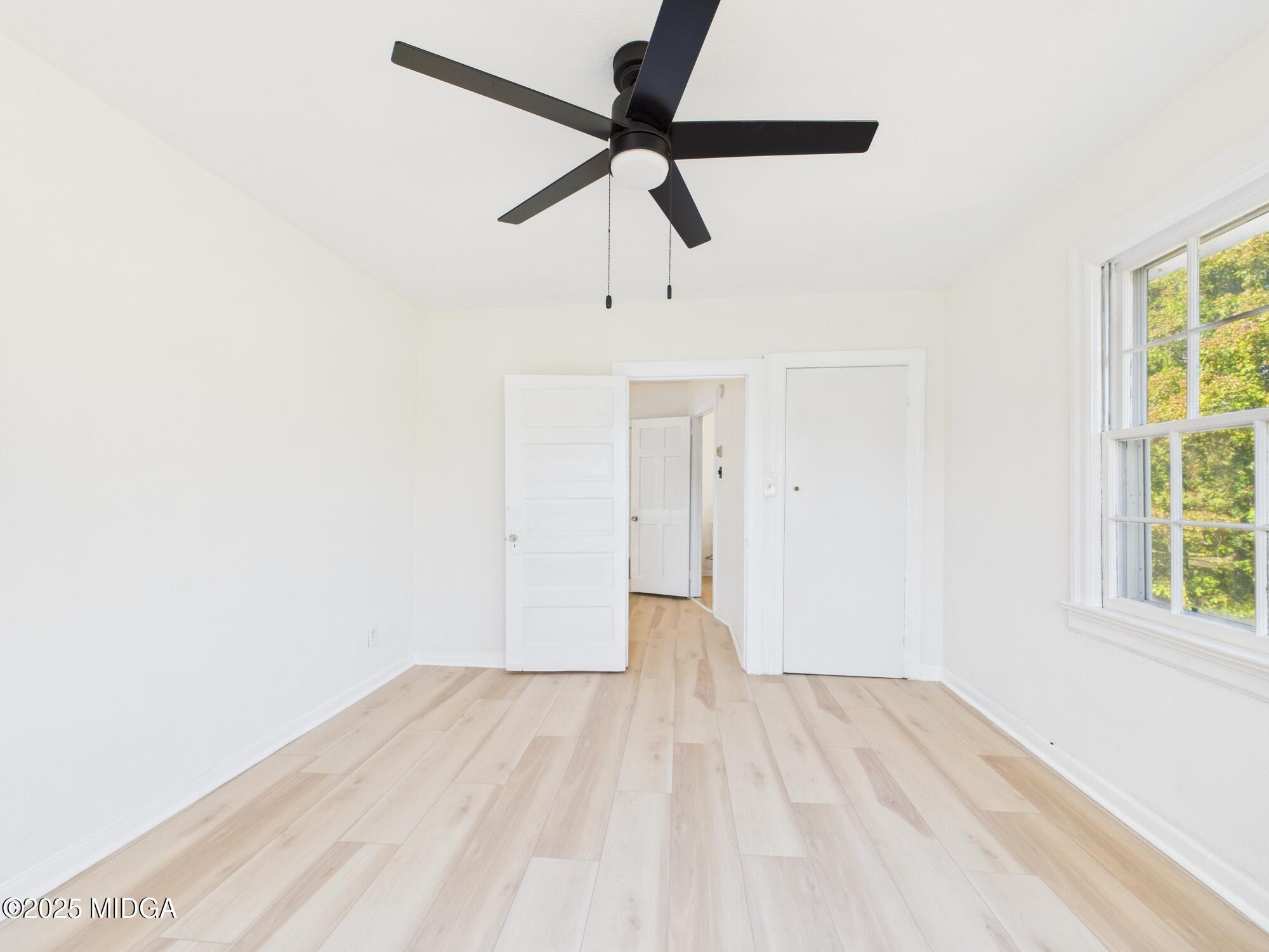 621 Forest Hill Road Macon, GA 31210 - Photo 37 of 50 a view of empty room with wooden floor and fan