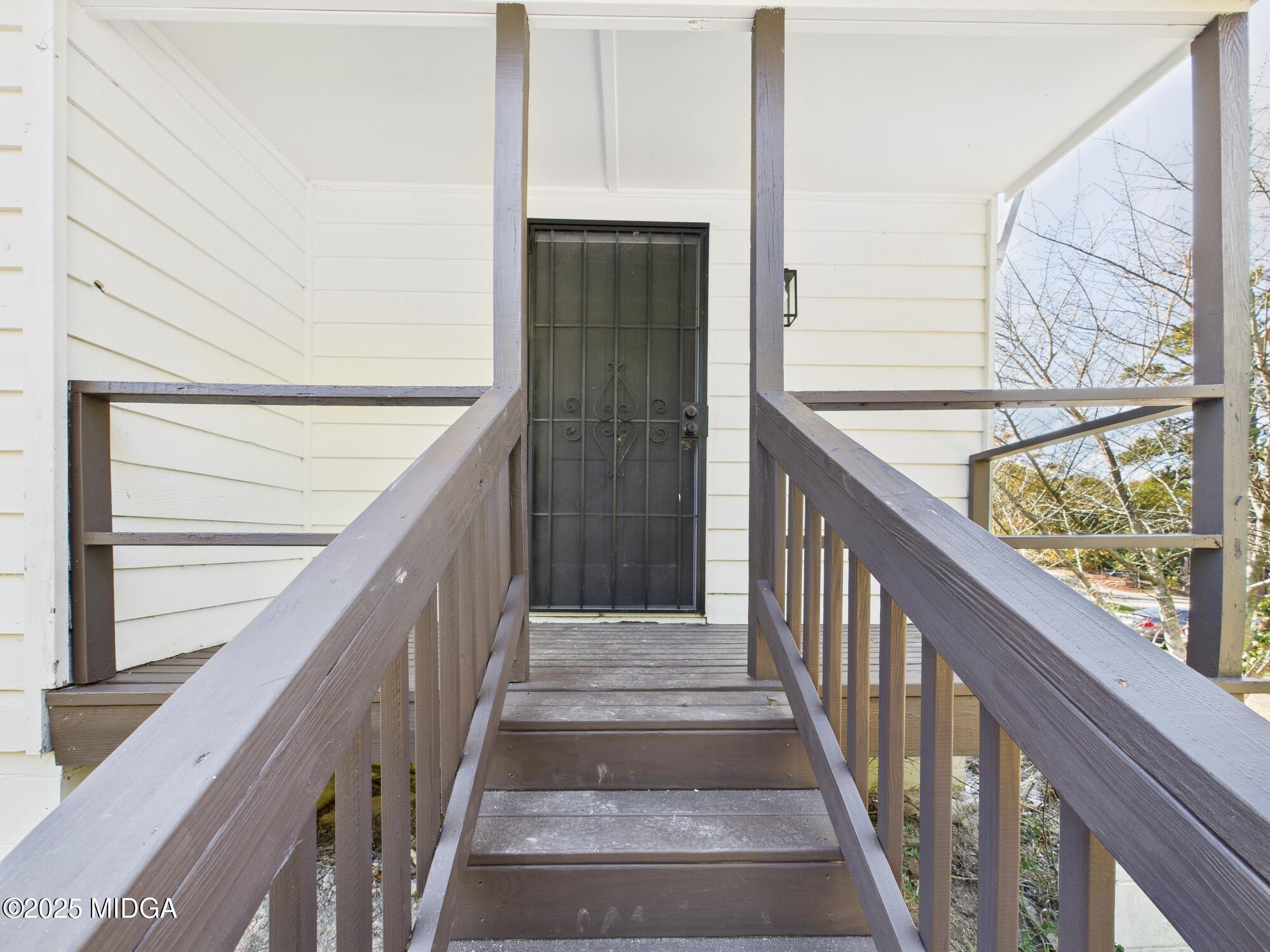621 Forest Hill Road Macon, GA 31210 - Photo 45 of 50 a view of staircase with wooden floor and a window