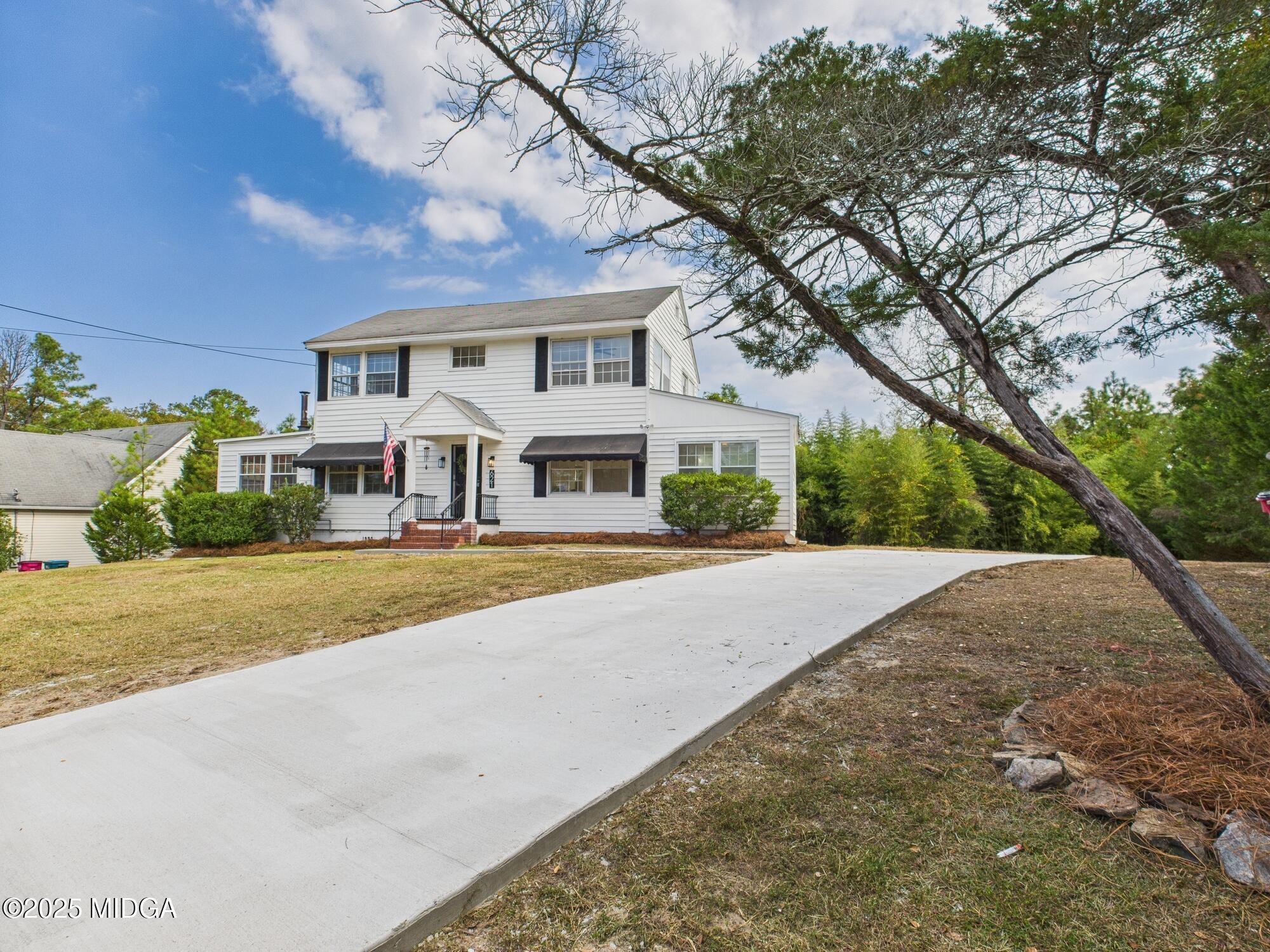 621 Forest Hill Road Macon, GA 31210 - Photo 47 of 50 a front view of a house with a yard and garage