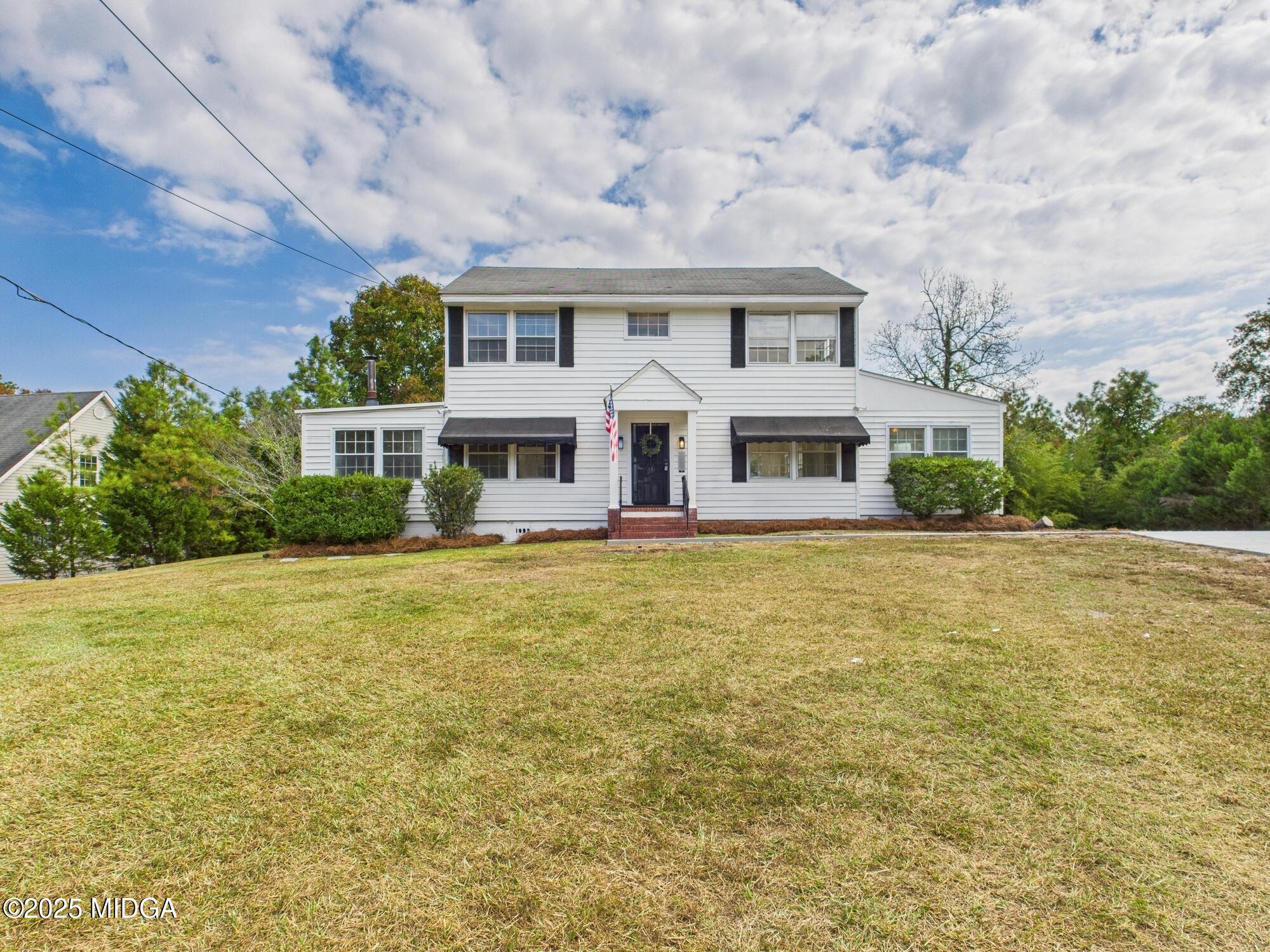621 Forest Hill Road Macon, GA 31210 - Photo 48 of 50 a front view of a house with swimming pool