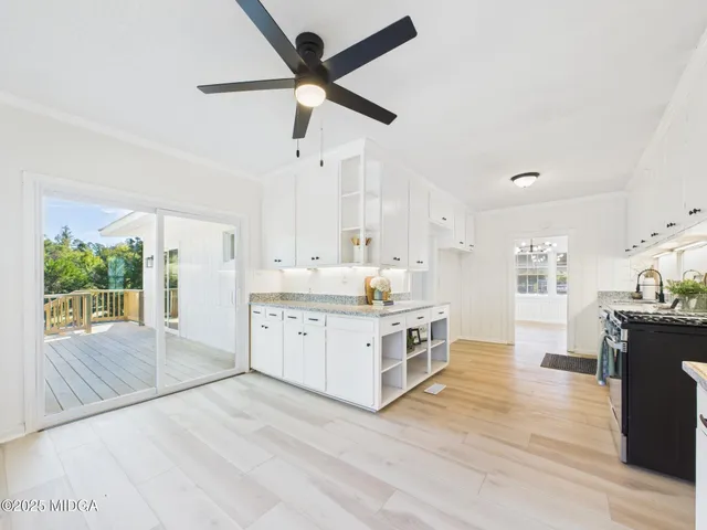 a kitchen with granite countertop cabinets and steel stainless steel appliances