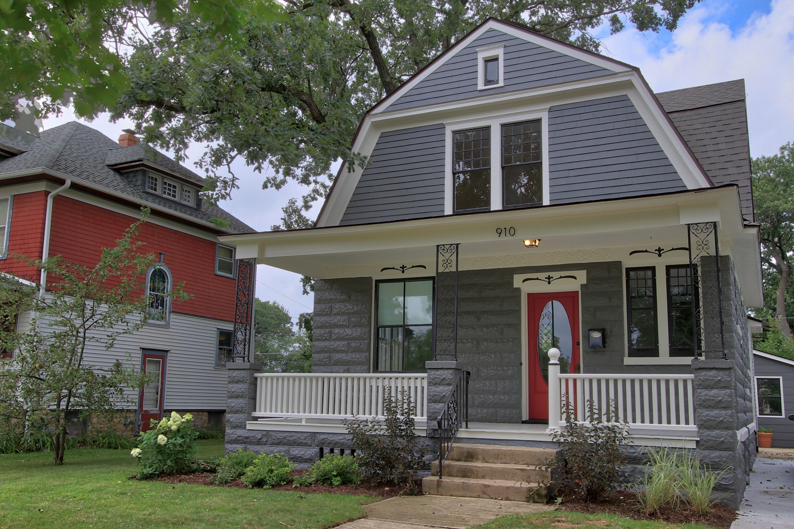 910 North Spring Street Elgin, IL 60120 - Photo 1 of 34 a front view of a house with garden