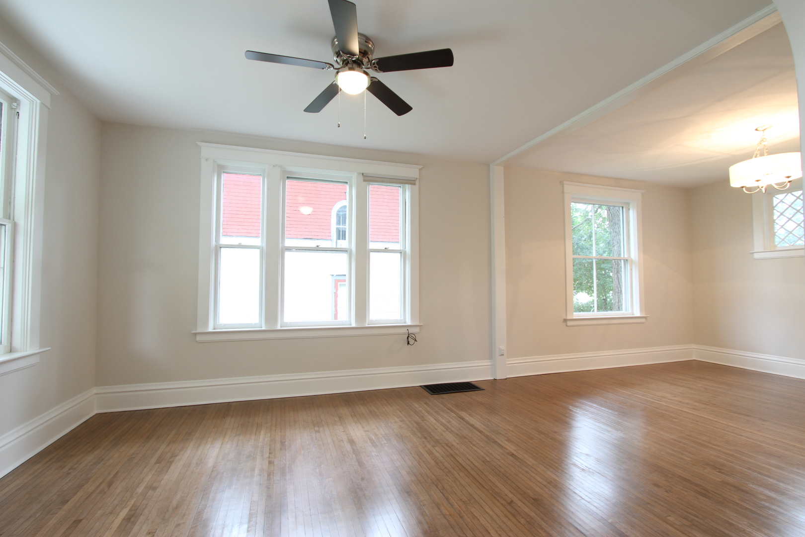 910 North Spring Street Elgin, IL 60120 - Photo 11 of 34 a view of an empty room with wooden floor and a window