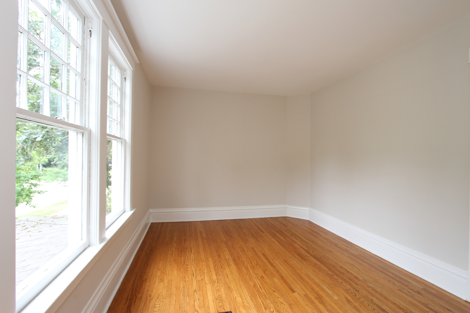 910 North Spring Street Elgin, IL 60120 - Photo 17 of 34 a view of empty room with wooden floor and fan