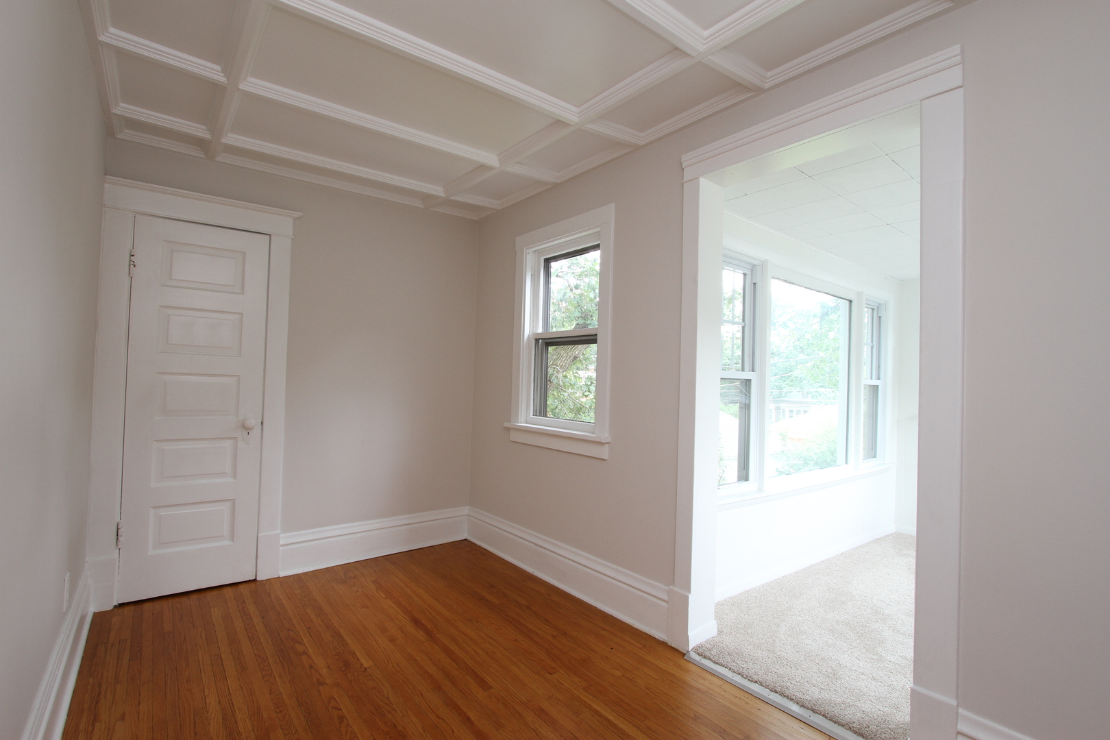 910 North Spring Street Elgin, IL 60120 - Photo 20 of 34 a view of an empty room with wooden floor and a window