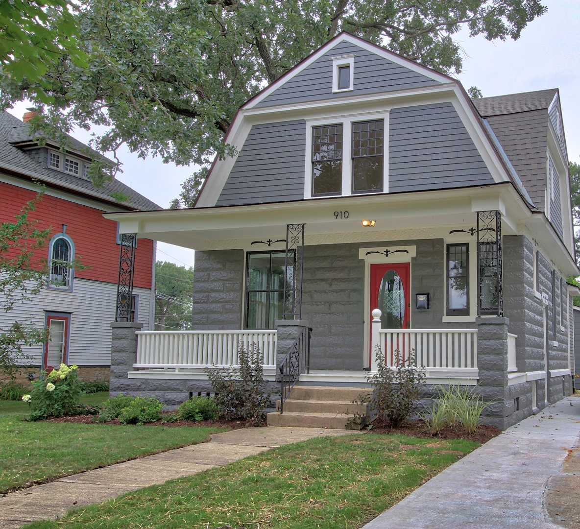 910 North Spring Street Elgin, IL 60120 - Photo 2 of 34 a front view of a house with a yard