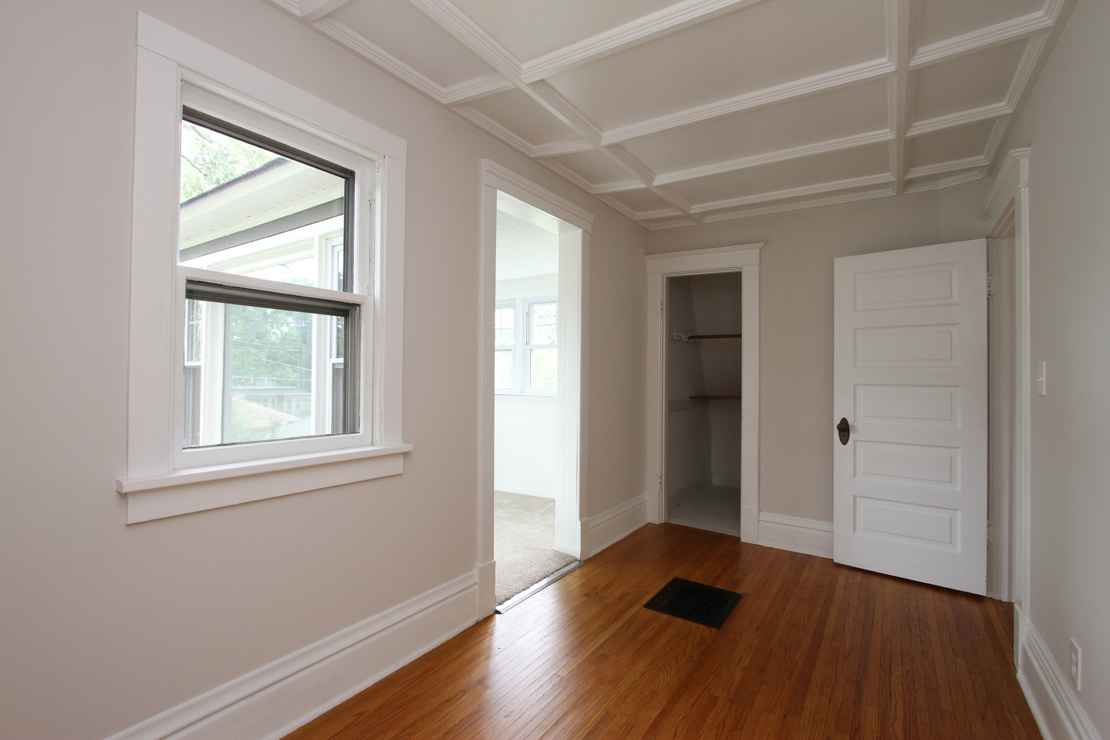 910 North Spring Street Elgin, IL 60120 - Photo 21 of 34 an empty room with wooden floor and windows