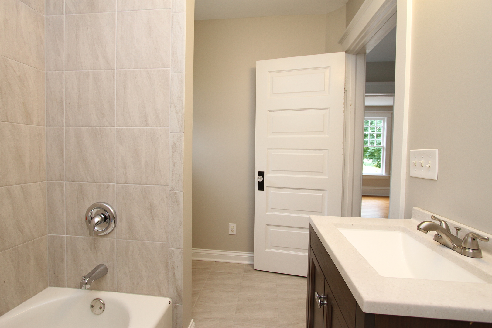 910 North Spring Street Elgin, IL 60120 - Photo 24 of 34 a bathroom with a sink a shower and a mirror