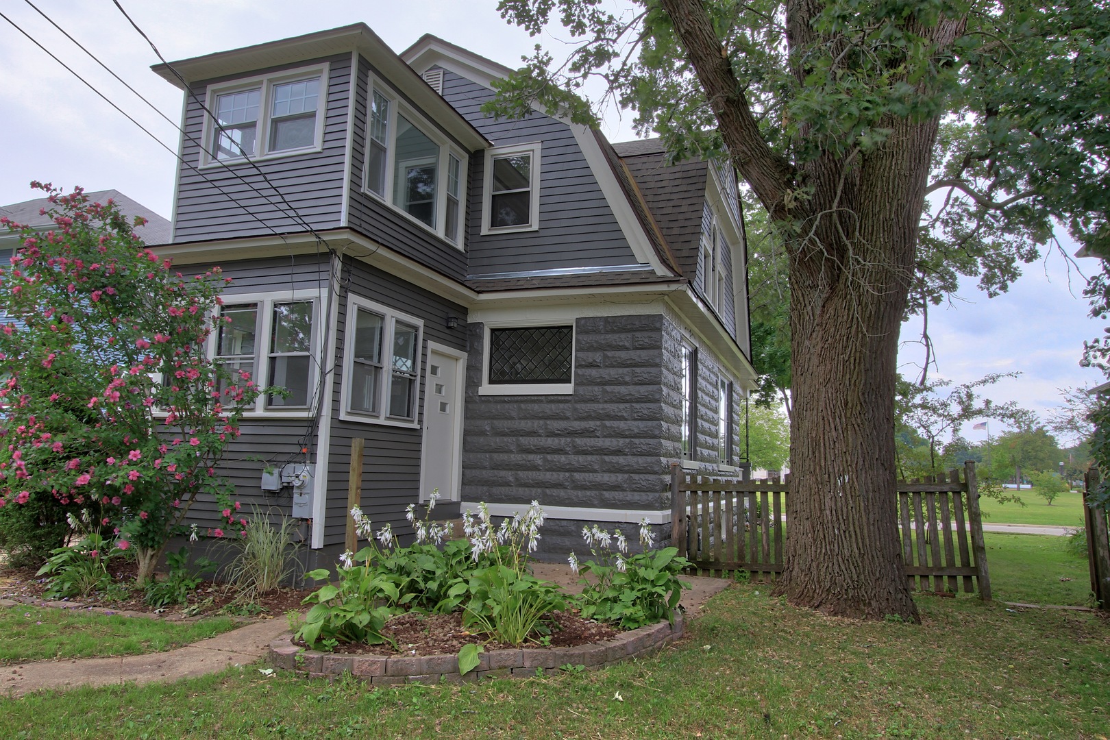 910 North Spring Street Elgin, IL 60120 - Photo 30 of 34 a front view of a house with a garden