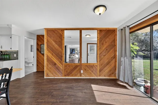 a view of a living room and a balcony