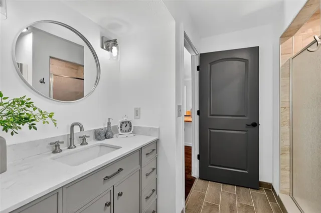 a bathroom with a sink and a mirror