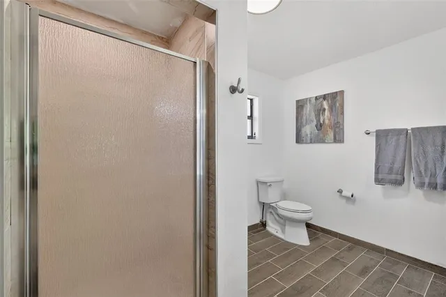 a white toilet sitting next to a bathroom sink