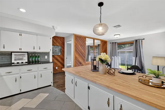 a kitchen with counter space cabinets and appliances
