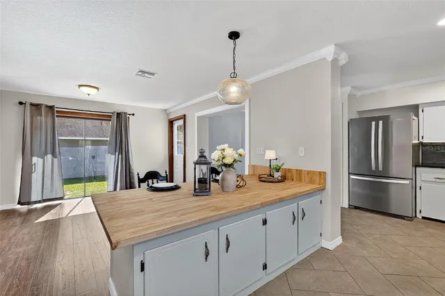 a kitchen with a sink and refrigerator