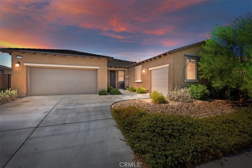 82185 Verdi Road Indio, CA 92203 - Photo 1 of 1 a front view of a house with garden