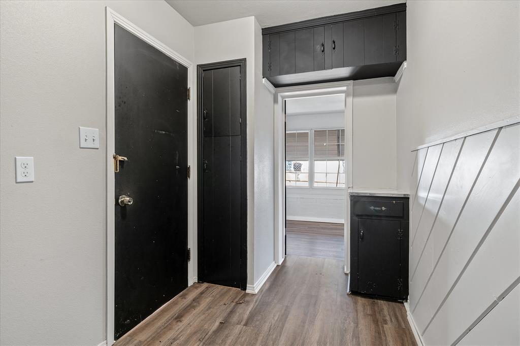 175 East Elm Street Canton, TX 75103 - Photo 11 of 25 a view of a hallway with wooden floor and closet