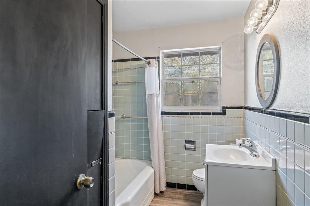175 East Elm Street Canton, TX 75103 - Photo 15 of 25 a bathroom with a sink toilet and shower