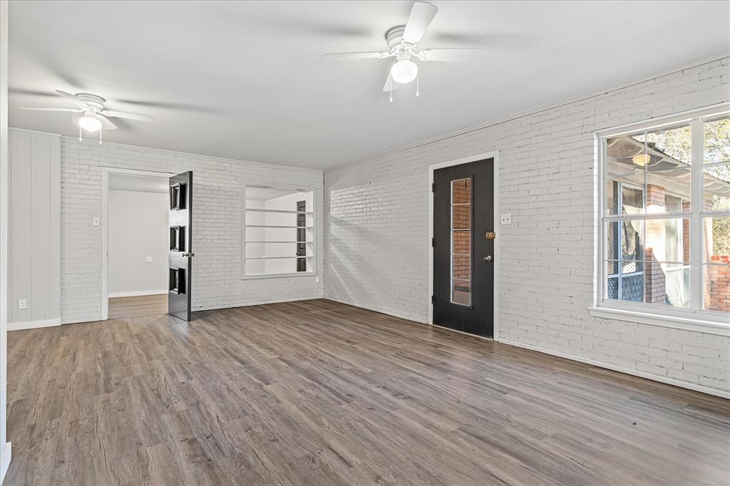 175 East Elm Street Canton, TX 75103 - Photo 2 of 25 a view of empty room with wooden floor and fan