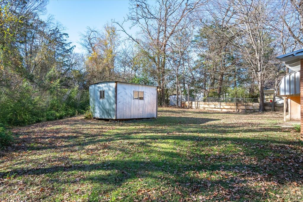 175 East Elm Street Canton, TX 75103 - Photo 24 of 25 a backyard of apartments with large trees