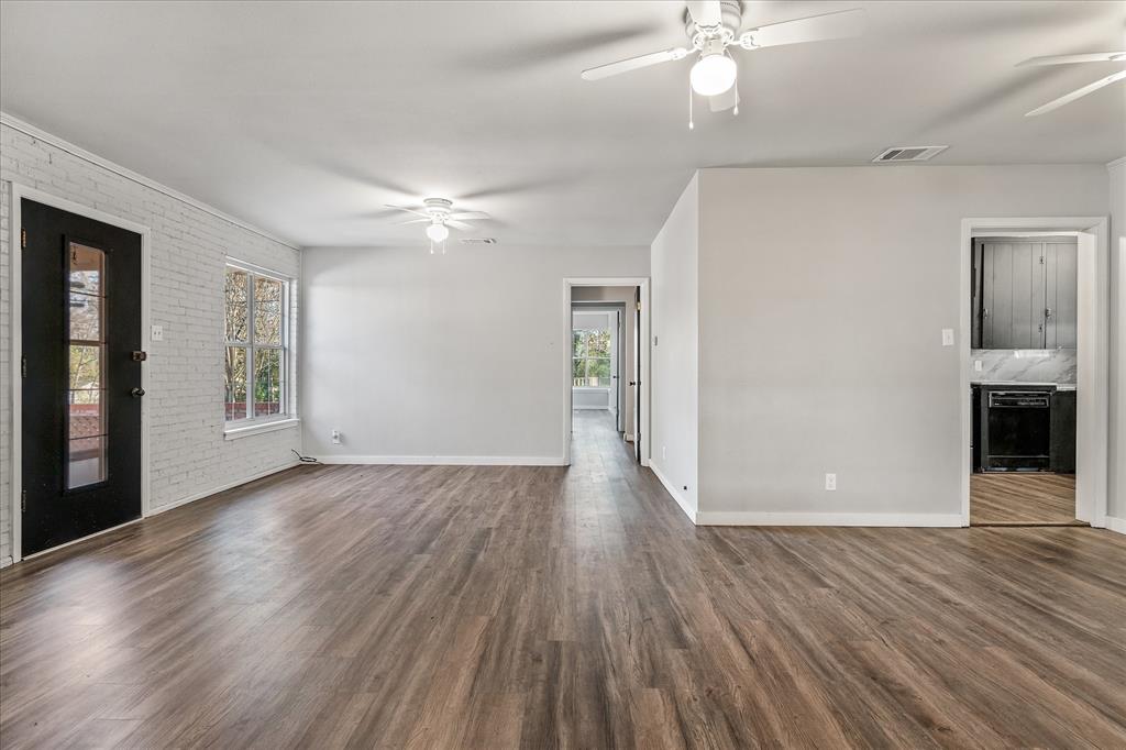 175 East Elm Street Canton, TX 75103 - Photo 4 of 25 wooden floor in an empty room with a window