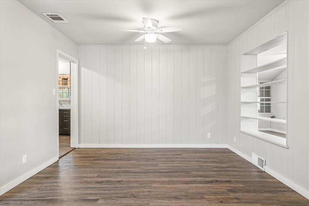 175 East Elm Street Canton, TX 75103 - Photo 5 of 25 wooden floor in an empty room with a window