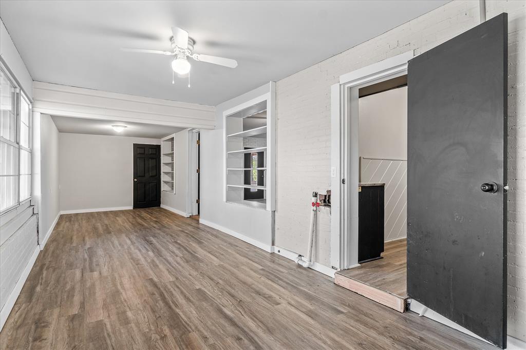 175 East Elm Street Canton, TX 75103 - Photo 9 of 25 wooden floor in an empty room with a window