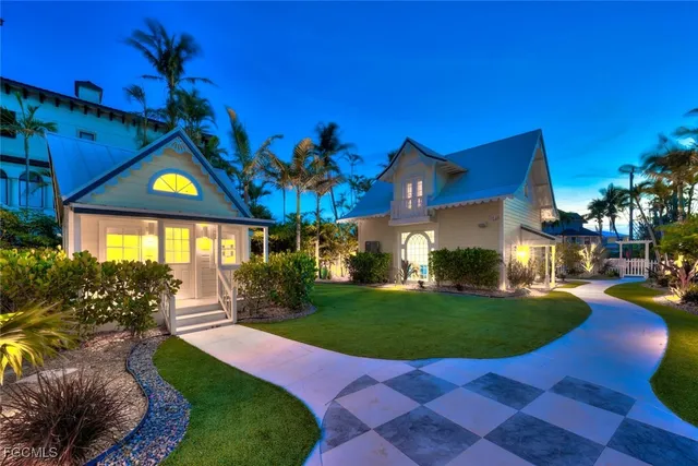 a view of a house with a yard porch and sitting area