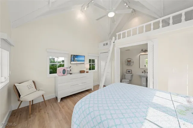 a bedroom with a large bed and a window