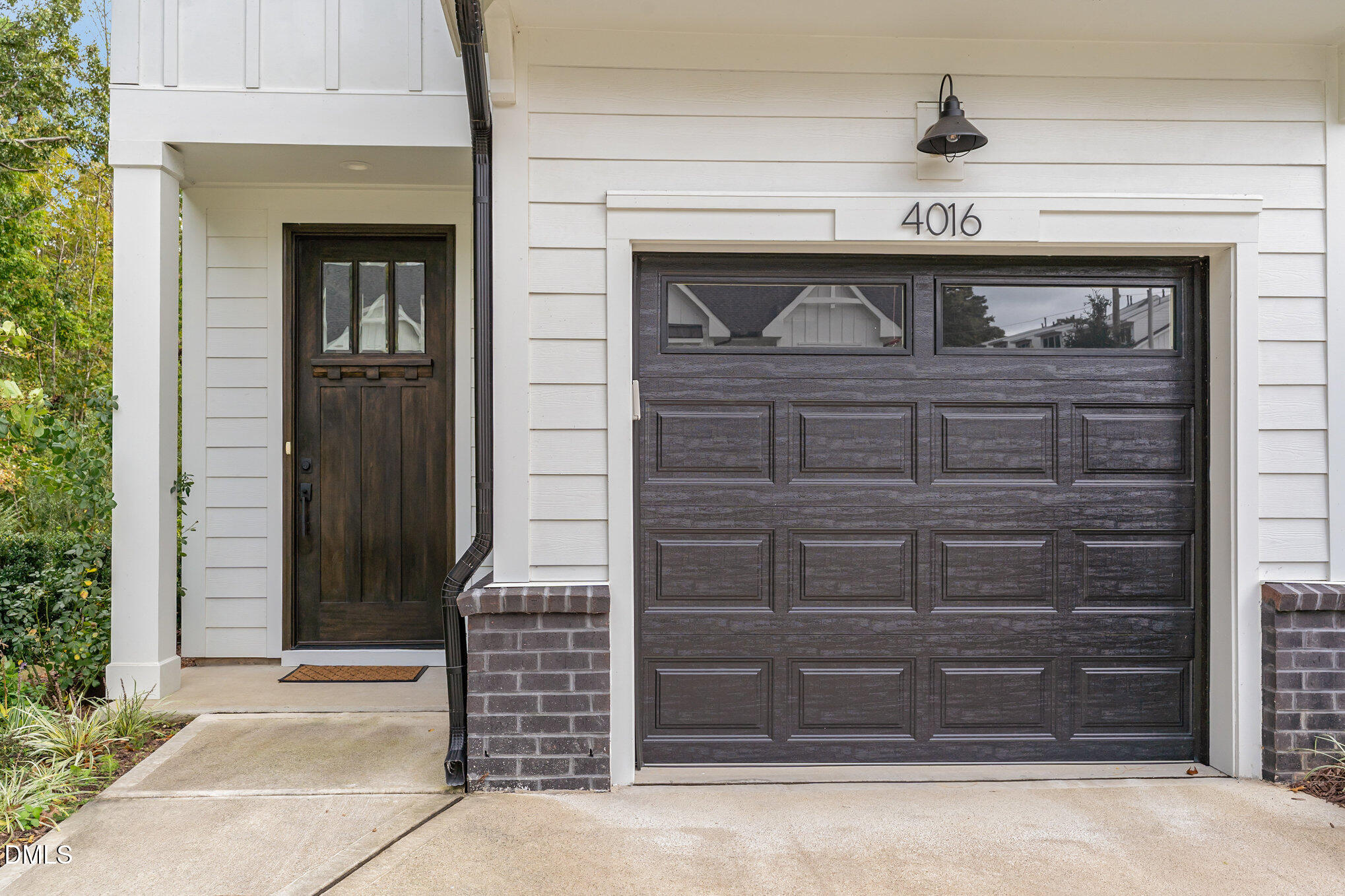 4016 Emerald Green Road Raleigh, NC 27612 - Photo 18 of 22 a front view of a house with a door and a door