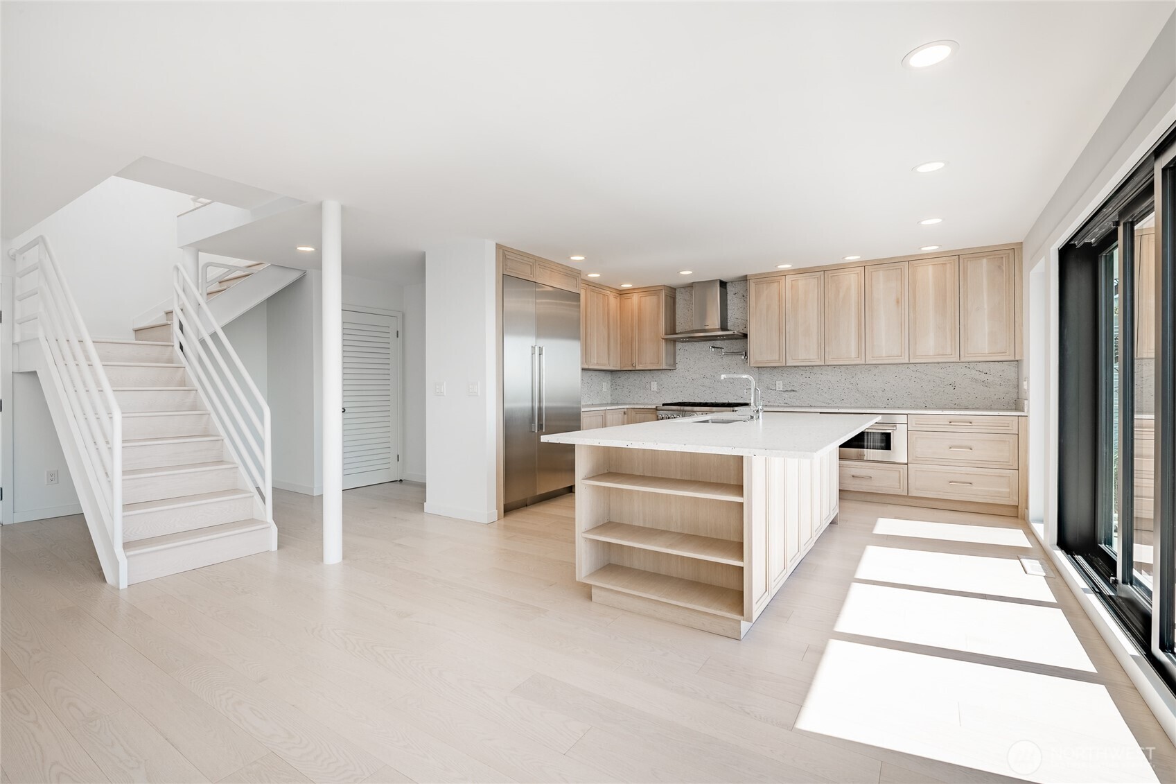 1613 Edwards Drive Point Roberts, WA 98281 - Photo 19 of 38 a kitchen with a refrigerator and white cabinets