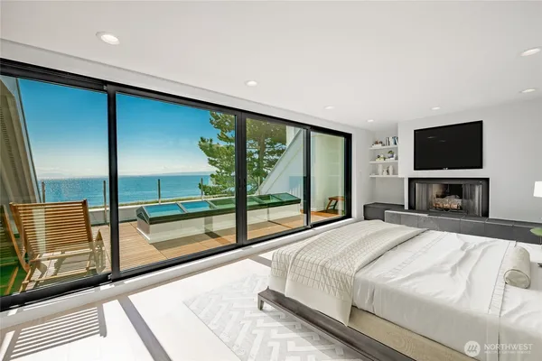 a view of an empty room with a floor to ceiling window and an entryway