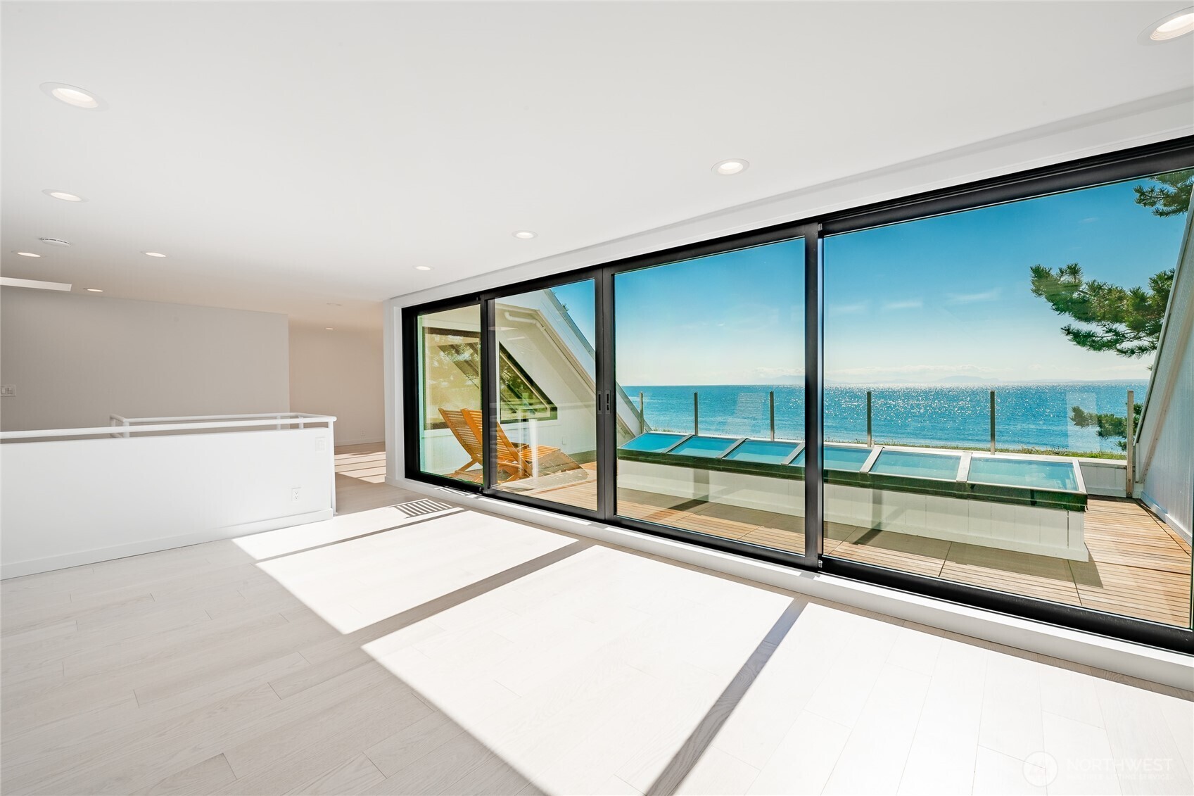 1613 Edwards Drive Point Roberts, WA 98281 - Photo 25 of 38 a view of an empty room with a floor to ceiling window and an entryway