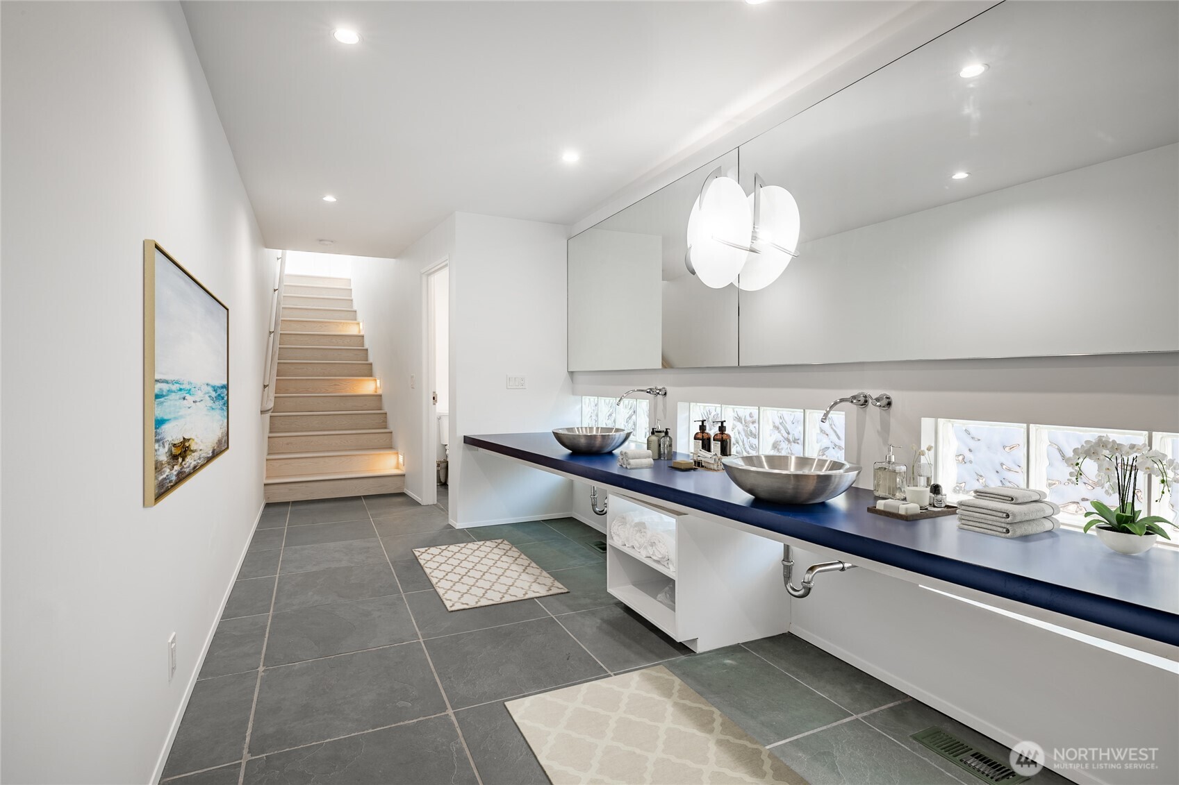 1613 Edwards Drive Point Roberts, WA 98281 - Photo 30 of 38 a room with stainless steel appliances kitchen island granite countertop a sink and cabinets