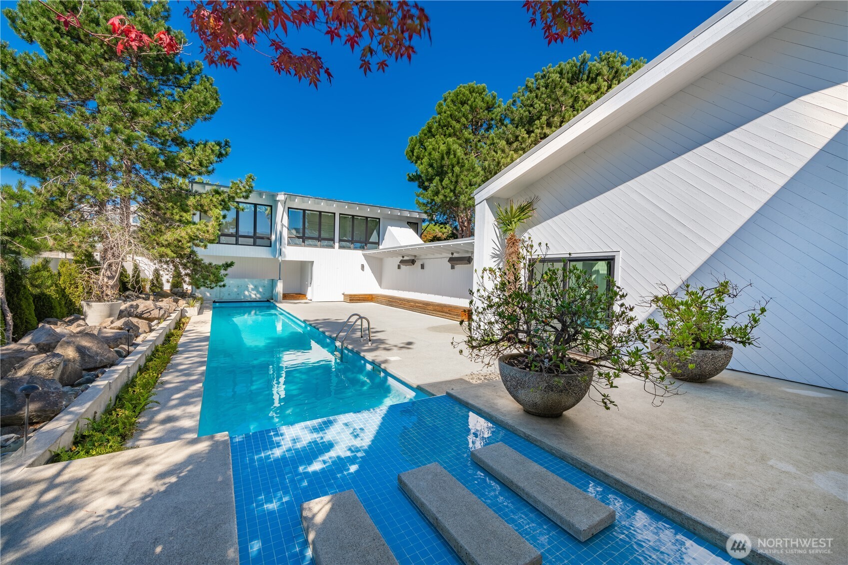 1613 Edwards Drive Point Roberts, WA 98281 - Photo 4 of 38 a view of a patio with couches table and chairs and potted plants