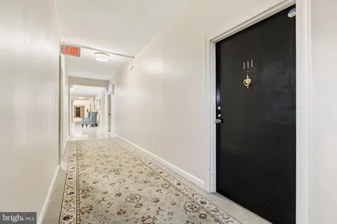 a view of a bathroom from a hallway