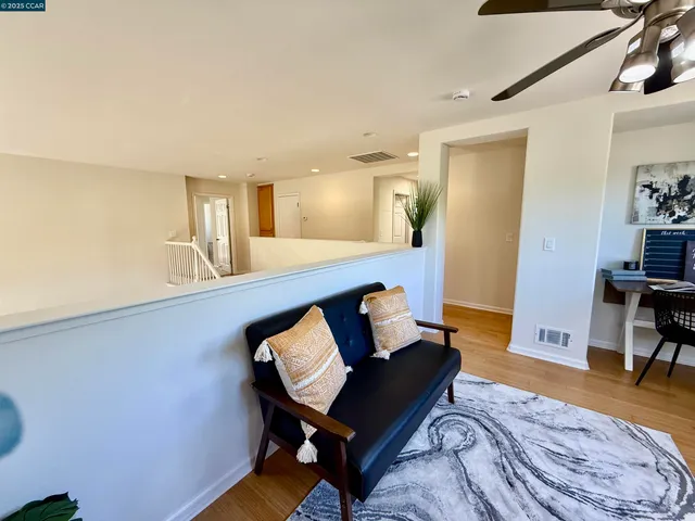 a living room with furniture and rug