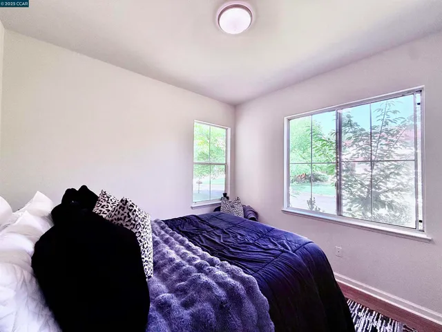 a bathroom with a sink mirror and a shower