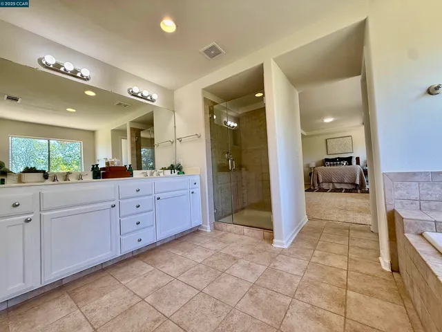 a bathroom with a bathtub and a sink