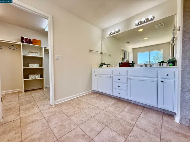 a bathroom with a sink mirror toilet and shower
