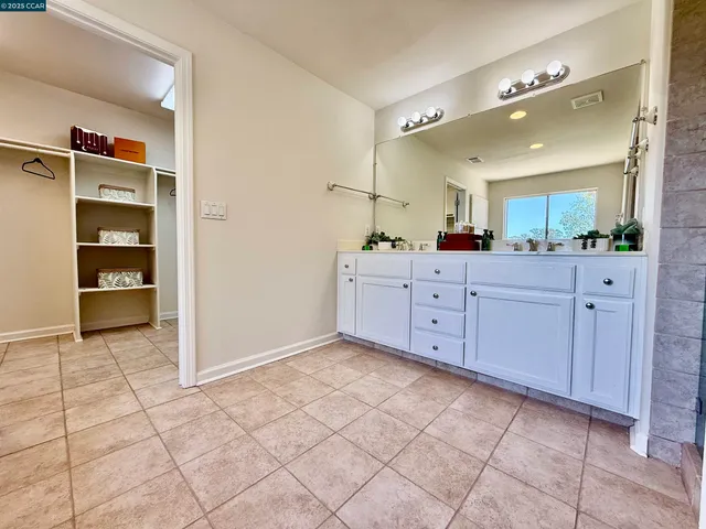 a hallway with wooden floor and furniture