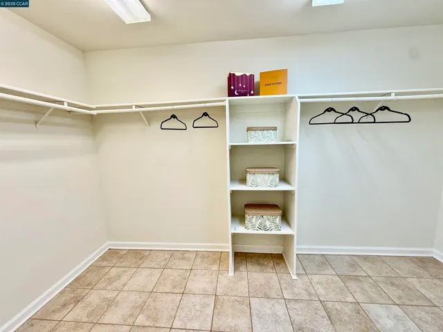 a view of hallway with stairs and wooden floor