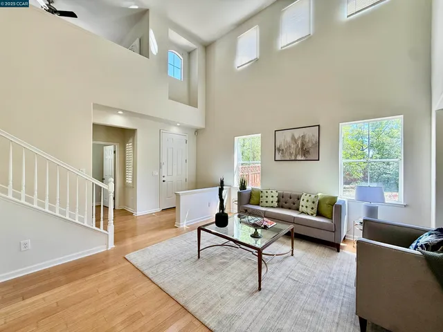 a living room with furniture and a rug