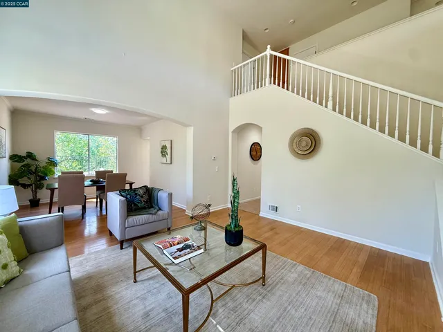 a living room with furniture and a table