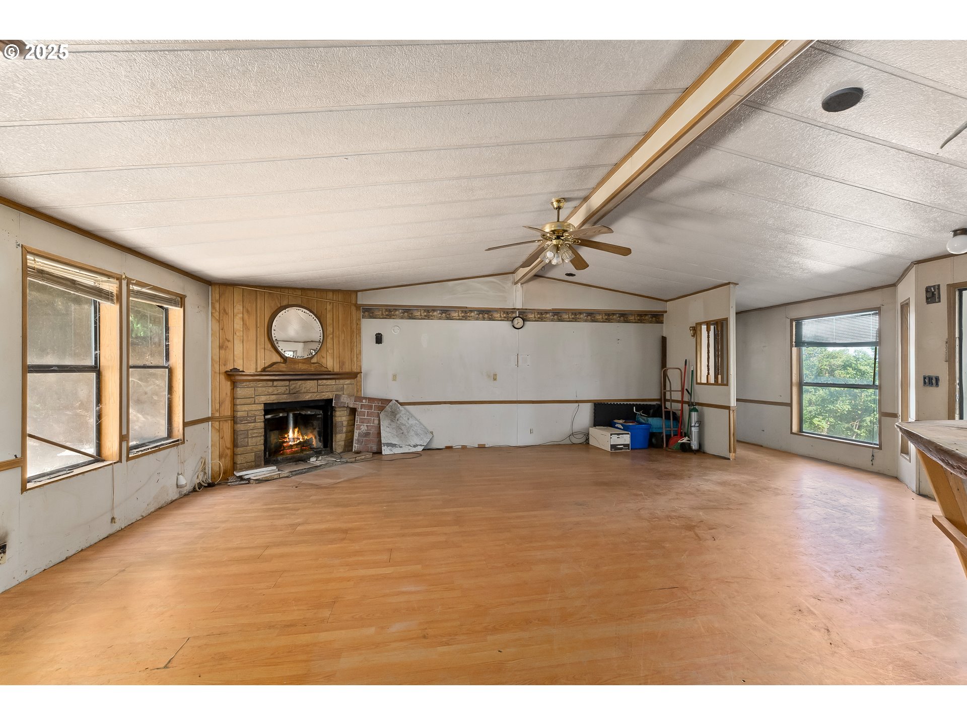 281 Callahan Road Roseburg, OR 97471 - Photo 14 of 39 a view of a livingroom with window and a fireplace